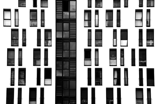 The photograph of a façade with symmetrically arranged windows.