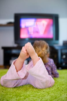 child is watching TV