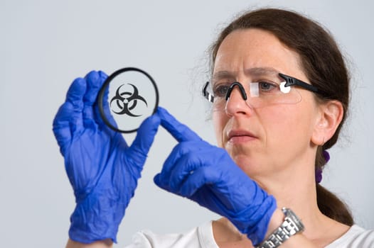 woman in laboratory with object holder