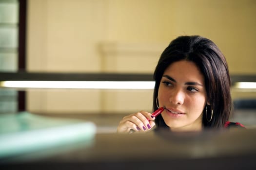 University library and female student, beautiful young woman studying and preparing test in college