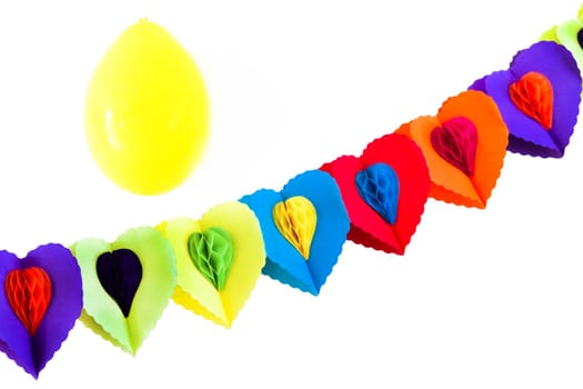 Party decoration - festoon and yellow balloon on white background