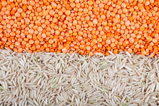 Food background with red lentils and brown basmati rice.