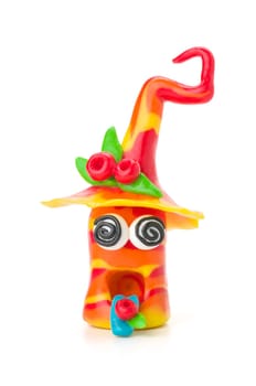 Handmade clay figure with rolled eyes
