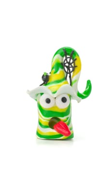 Handmade clay figure with spider and web