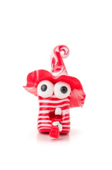 Handmade clay figure with red stripes