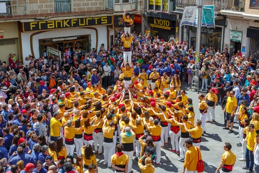 BARCELONA, SPAIN - MAY 19: Some unidentified people called Castellers do a Castell or Human Tower, typical tradition in Catalonia, on May 19, 2013 in Barcelona, Spain.