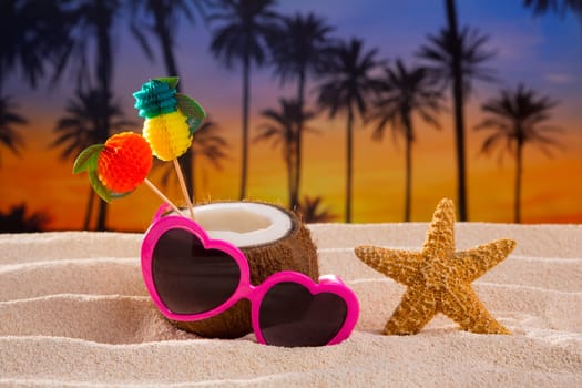 Coconut cocktail on tropical white sand beach heart shape funny sunglasses