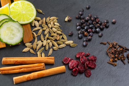 cloves cardamom cinnamon juniper berries and dried cranberries Gyn tonic spices with lemon and cucumber