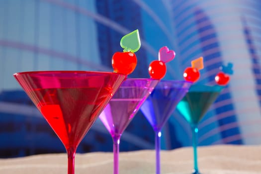 colorful cocktail in a row with cherry sand in urban city building