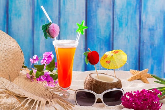 tropical cocktails on blue wood and sand sex on the beach and coconut