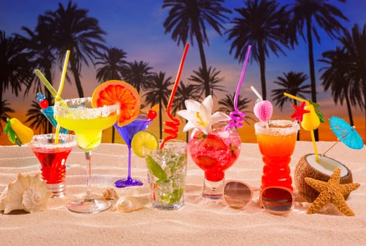 beach tropical cocktails on white sand mojito blue hawaii on sunset palm trees