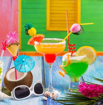 Colorful tropical Cocktails in tropical Caribbean house with coconut pepermint margarita
