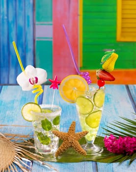Mojito and lemon lime Cocktails in tropical blue wood in cuban mexican colorful house