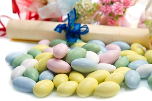 different colored candy favor on white background