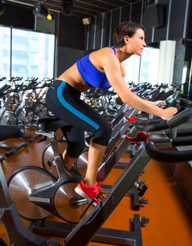 Aerobics spinning woman exercise workout at bikes gym