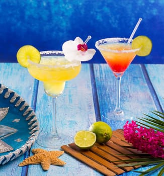 Cocktails mexican Margarita and sex on the beach on blue Caribbean wood