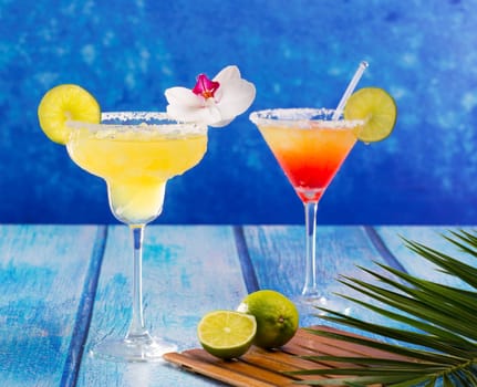Cocktails mexican Margarita and sex on the beach on blue Caribbean wood
