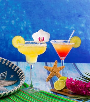 Cocktails mexican Margarita and sex on the beach on blue Caribbean wood