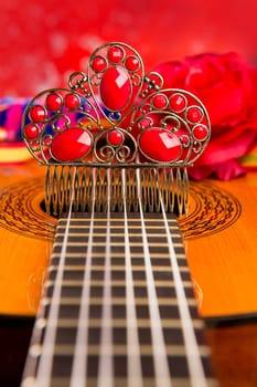 Classic spanish guitar with flamenco elements as dancer comb