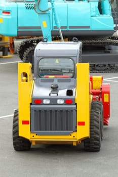 Skid steer front loader machine at construction site