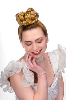 Portrait of a young bride with high hair und white bride dress.