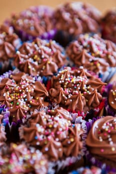 Closeup of chocolate cupcakes with decorative sprinkles