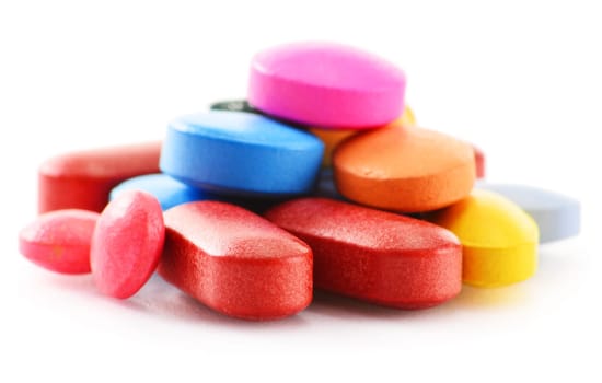 Composition with drug pills isolated on white background