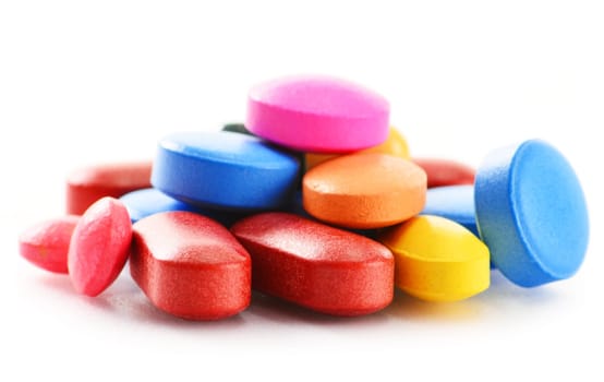 Composition with drug pills isolated on white background
