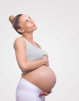 pregnant woman holding her belly very big