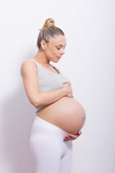 pregnant woman holding her belly very big