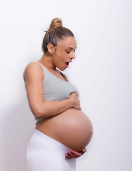 pregnant woman holding her belly very big