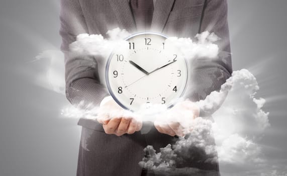 Business man holding clock, world map from www.lib.utexas.edu