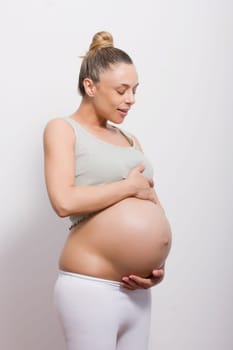 pregnant woman holding her belly very big