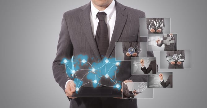 business man holding a tablet, grey background. world map from www.lib.utexas.edu