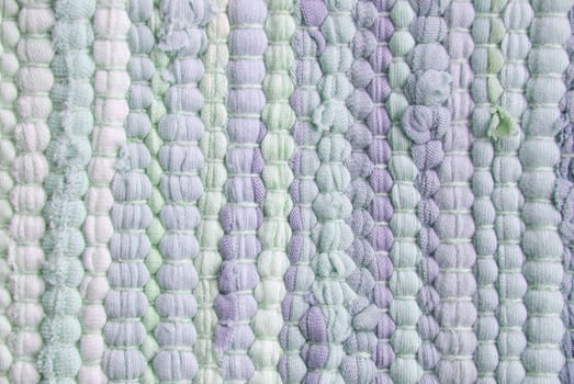 a green and purple carpet structure as texture or background