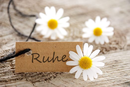 a natural looking paper tah with the german word RUHE which means calm down