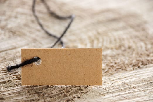 natural background with copy space a brown label tag on wood