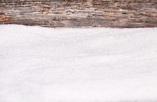 sand and a pice of driftwood as background