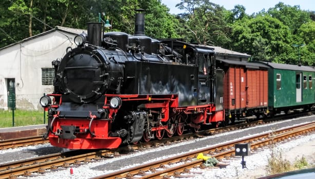 Old steam locomotive "Rasender Roland"" at the Islan Rügen, Germany, Baltic Sea"