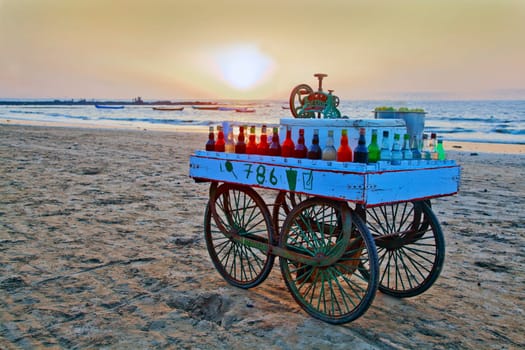 India slush ice street vendors cart hoping to do some trade before the end of a day on the beach at Manori, Bombay, India