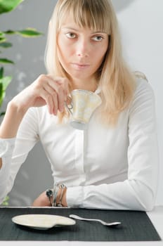 young beautiful girl with cup of drink
