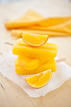 Homemade orange ice popsicles