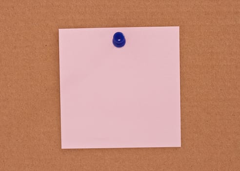 Pink note paper attached with blue pin