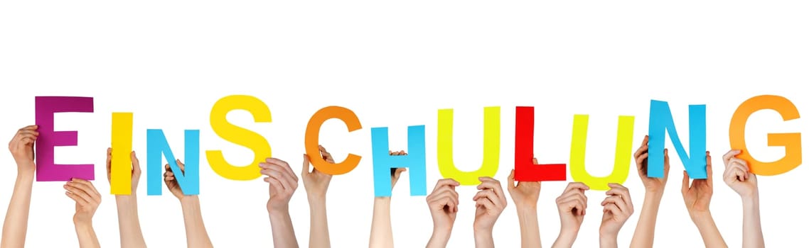 many hands holding the german word Einschulung which means schoolo enrollment, isolated