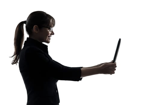 one business woman computer computing digital tablet  silhouette studio isolated on white background