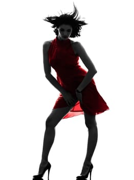 one caucasian fashion model sexy woman in red dress in silhouette studio isolated on white background