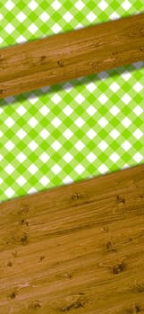 Wooden boards as text background with tablecloth in white and green