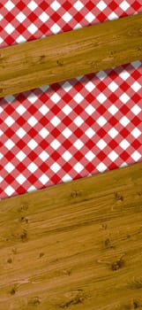 Wooden boards as text background with tablecloth in white and red