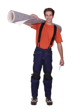 Man with a roll of linoleum