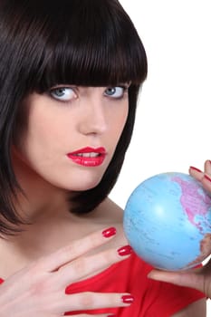 Portrait of a woman with globe
